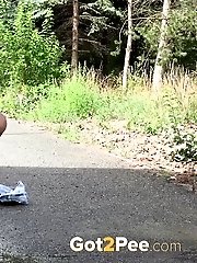 15 pictures - Dark haired babe suffers severe piss desperation