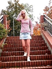 15 pictures - Pretty blonde squats on steps outside to piss