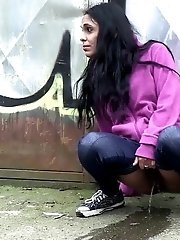 15 pictures - Pretty black haired girl leaves a piss puddle