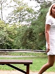 15 pictures - Pretty blonde pisses outside on a bench