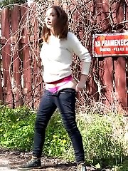 15 pictures - Public pissing for brunette babe who squats