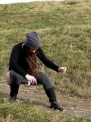 15 pictures - Dark haired babe pisses in the countryside
