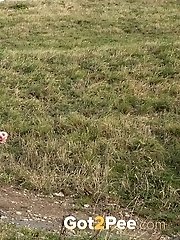 15 pictures - Dark haired babe pisses in the countryside