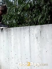 15 pictures - Pretty babe lifts her leg up to piss outside