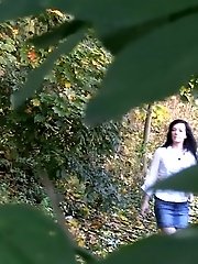15 pictures - Sexy raven haired girl pisses in the leaves