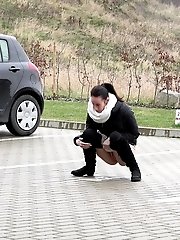 15 pictures - Eveline Neill squats to piss in a car park