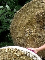15 pictures - Cute blonde pees on some hay