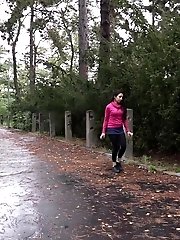15 pictures - Dark haired girl squats to piss on a road