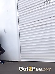 15 pictures - Dark haired girl is desperate to pee when walking