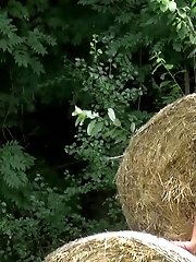 15 pictures - Cute blonde pees on some hay