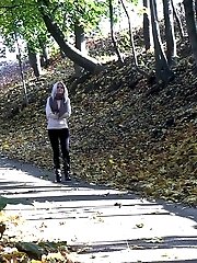 15 pictures - Hot blonde pisses on a tree lined path