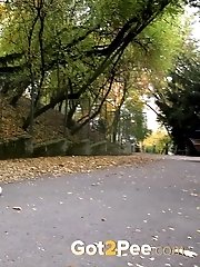 15 pictures - Sexy blonde in leggings pisses on the ground