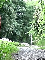 15 pictures - Pretty redhead pisses outside while standing
