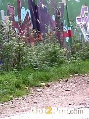15 pictures - Hot dark haired girl squats on a path to pee