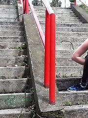 15 pictures - Dark haired girl pisses on concrete steps