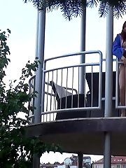 15 pictures - Pretty redhead pisses over her balcony