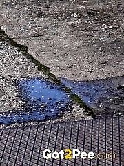 15 pictures - Dark haired girl is desperate to pee when walking