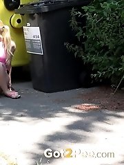 15 pictures - European babe pisses next to recycling bins