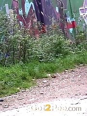 15 pictures - Hot dark haired girl squats on a path to pee