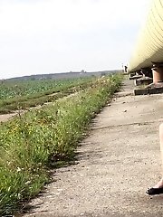15 pictures - Playful blonde pissing over the ground outside