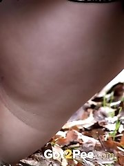 15 pictures - Chubby girl squats outside to piss in the woods