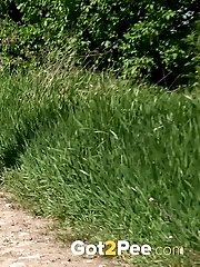 15 pictures - Public pissing on dirt road for this blonde