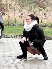 15 pictures - Eveline Neill squats to piss in a car park