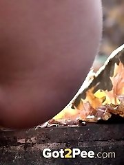 15 pictures - Messy outdoor pissing for pretty blonde babe