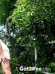 15 pictures - Pretty blonde squats in a cycle track to piss
