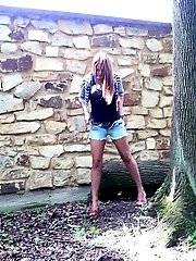 15 pictures - Gorgeous girl squats near a log to piss outside