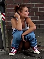 15 pictures - Cute babe makes a piss puddle on the concrete