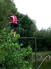 15 pictures - Hot brunette pisses next to a local pond
