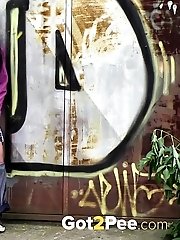 15 pictures - Pretty black haired girl leaves a piss puddle