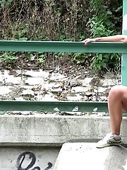 15 pictures - Gorgeous dark haired girl pisses onto concrete