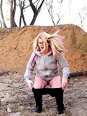 15 pictures - Cute blonde in glasses pisses over the ground