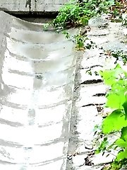 15 pictures - Gorgeous dark haired girl pisses onto concrete