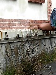 15 pictures - Sexy brunette lifts up her dress to piss