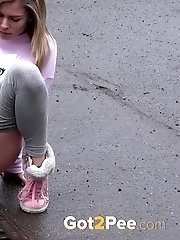 15 pictures - Blonde babe Claudia pisses down a drain outside