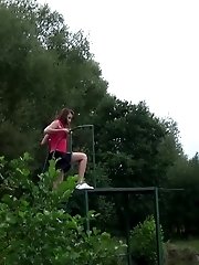 15 pictures - Hot brunette pisses next to a local pond