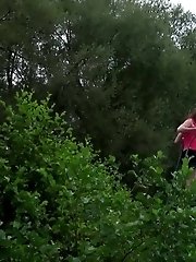 15 pictures - Hot brunette pisses next to a local pond