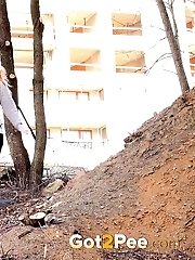 15 pictures - Cute blonde in glasses pisses over the ground