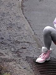 15 pictures - Blonde babe Claudia pisses down a drain outside