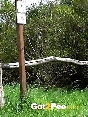 15 pictures - Pretty blonde girl pisses on the grass