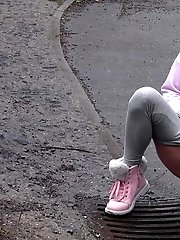 15 pictures - Blonde babe Claudia pisses down a drain outside
