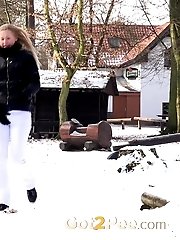 15 pictures - Sweet blonde pees onto a wooden bench outside