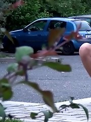 15 pictures - Redhead babe leans against a post to pee