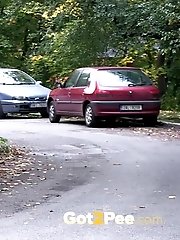 15 pictures - Brunette teen pees in front of passing traffic