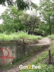 15 pictures - Cute blonde squatting to pee outside in public