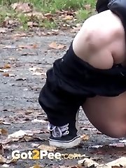 15 pictures - Blonde babe pees next to some garages