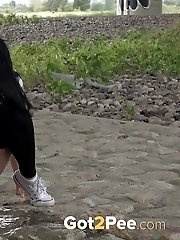 15 pictures - Exotic babe squats to piss near main road